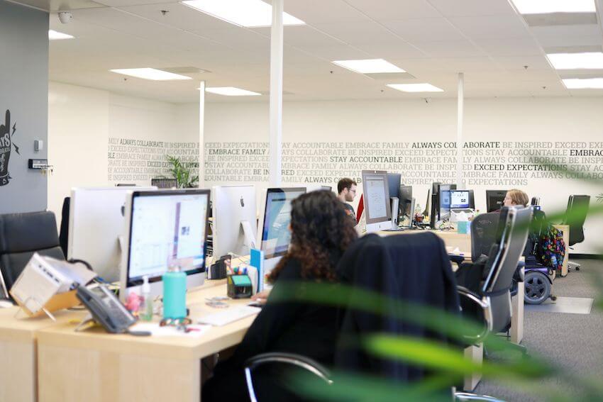 employees working open workspace